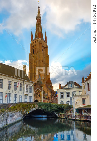 canal Dijver and a Church of Our Lady in Bruges 14750982