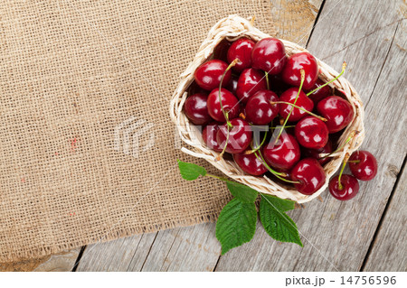 Ripe cherries on wooden table 14756596