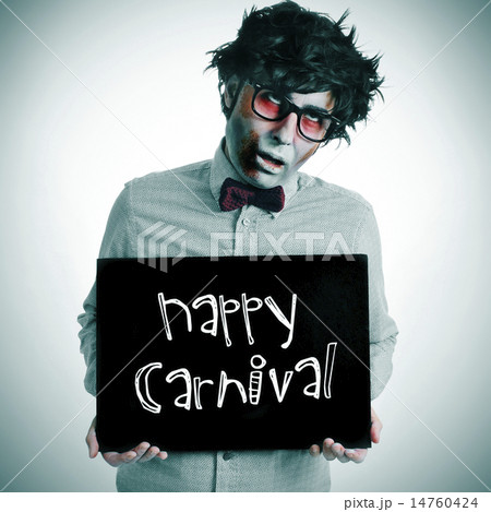 man with a zombie costume with a signboard with the text happy c 14760424