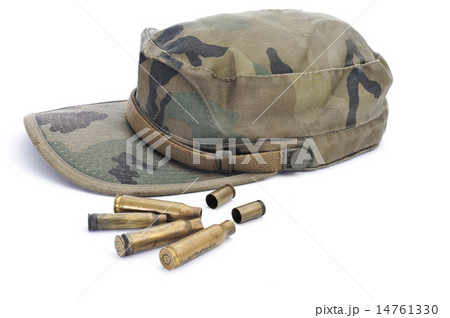 camouflage cap and empty bullets camouflage cap and empty bullets 14761330