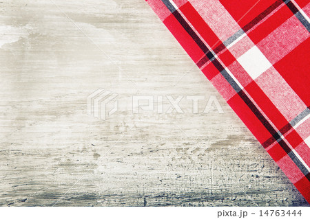 Top view of checkered napkin on wooden table Top view of checkered napkin on wooden table 14763444