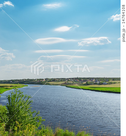river with green riverside and light cloudy sky river with green riverside and light cloudy sky 14764108