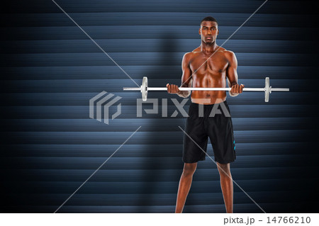 Composite image of portrait of a serious fit young man lifting b 14766210
