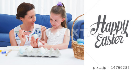 Composite image of mother and daughter painting easter eggs 14766282