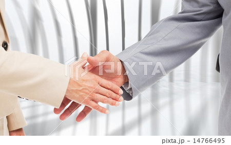 Composite image of close up of business people shaking their han Composite image of close up of business people shaking their han 14766495