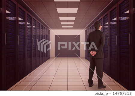 Composite image of businessman standing and looking Composite image of businessman standing and looking 14767212