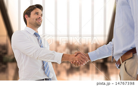 Composite image of young businessmen shaking hands in office Composite image of young businessmen shaking hands in office 14767398