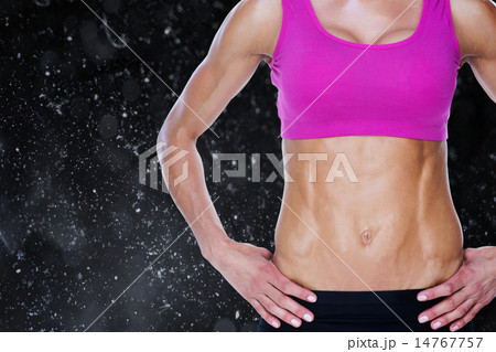 Composite image of female bodybuilder posing with hands on hips 14767757