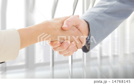 Composite image of closeup of shaking hands after business meeti Composite image of closeup of shaking hands after business meeti 14768145