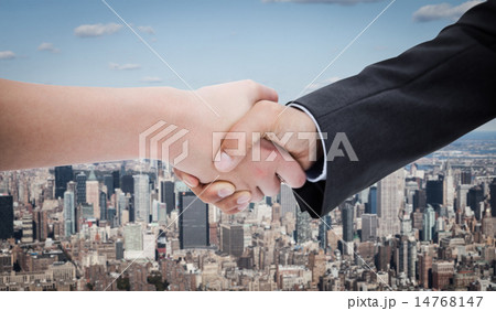 Composite image of close up of a handshake 14768147