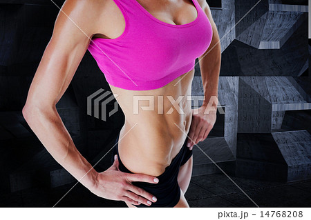 Composite image of female bodybuilder posing in pink sports bra 14768208