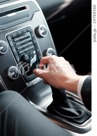 Handsome young man in dealership 14769386