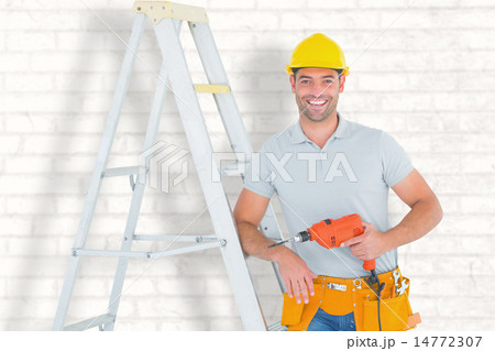 Composite image of happy handyman with power drill leaning on ladder Composite image of happy handyman with power drill leaning on ladder 14772307