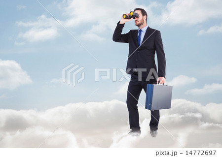 Composite image of businessman looking through binoculars holding briefcase Composite image of businessman looking through binoculars holding briefcase 14772697