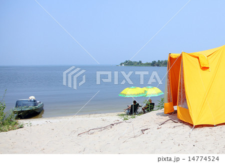Rest near the river Dnepr with tents and boat 14774524