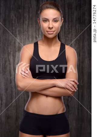 Young mixed race sporty woman looking at camera 14776274