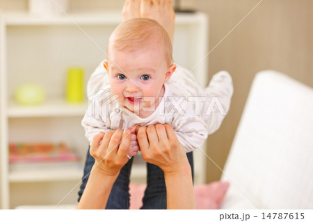 Baby playing with mother at home 14787615