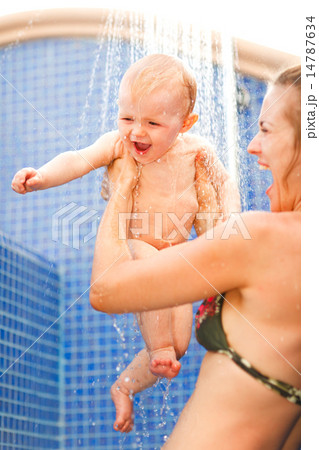 Young mother and happy baby taking shower Young mother and happy baby taking shower 14787634