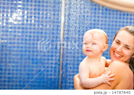 Portrait of mother and baby taking shower Portrait of mother and baby taking shower 14787640