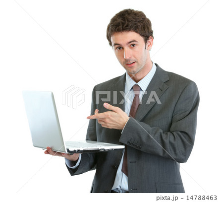 Surprised businessman pointing in laptop Surprised businessman pointing in laptop 14788463