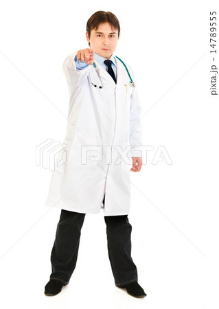 Full length portrait of confident medical doctor pointing finger at you. Full length portrait of confident medical doctor pointing finger at you. 14789555