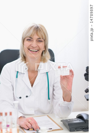 Middle age doctor woman showing business card 14789897