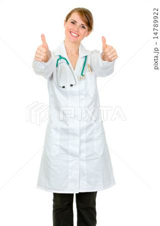 Smiling medical doctor woman showing thumbs up gesture. 14789922