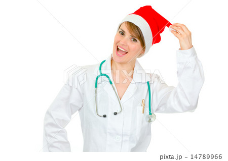 Happy medical doctor woman in Santa hat holding pompom. 14789966