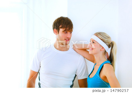 Portrait of handsome guy and pretty girl in sportswear Portrait of handsome guy and pretty girl in sportswear 14790257