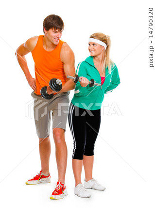 Young man and fitness girl lifting a dumbbell isolated on white Young man and fitness girl lifting a dumbbell isolated on white 14790320
