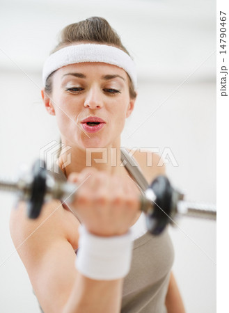 Young sport woman workout with dumbbells Young sport woman workout with dumbbells 14790467