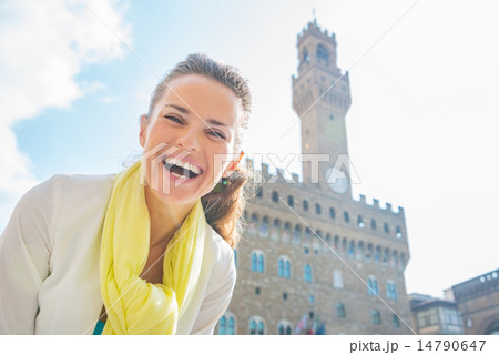 Happy young woman in front of palazzo vecchio in florence, italy Happy young woman in front of palazzo vecchio in florence, italy 14790647