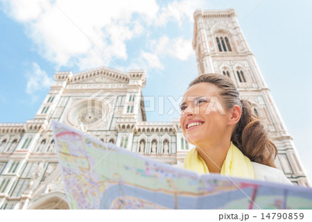 Happy young woman with map in front of duomo in florence, italy Happy young woman with map in front of duomo in florence, italy 14790859