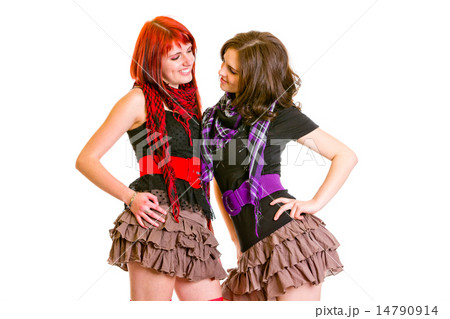 Two pretty cheerful girlfriends looking at each other. Two pretty cheerful girlfriends looking at each other. 14790914