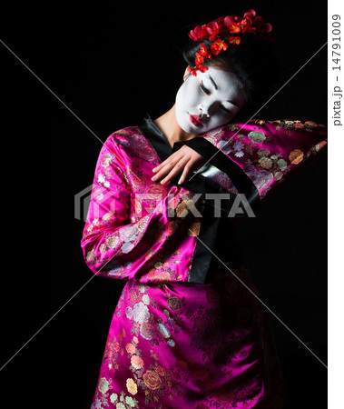 Portrait of geisha dancing isolated on black 14791009