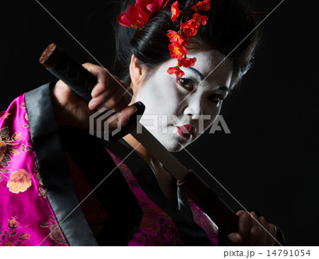Portrait of geisha pulls out sword of sheath on black Portrait of geisha pulls out sword of sheath on black 14791054