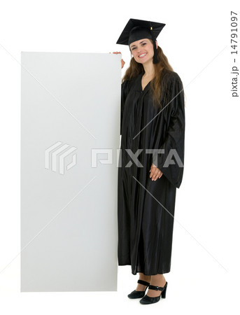 Full length portrait of happy graduation student holding blank b Full length portrait of happy graduation student holding blank b 14791097