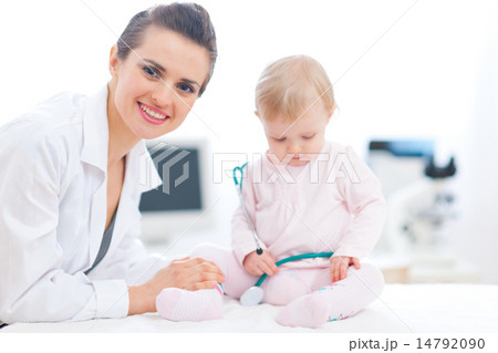 Pediatric doctor with baby on survey Pediatric doctor with baby on survey 14792090