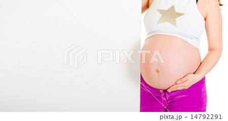 Pregnant woman holding blank billboard. Close-up.. Pregnant woman holding blank billboard. Close-up.. 14792291
