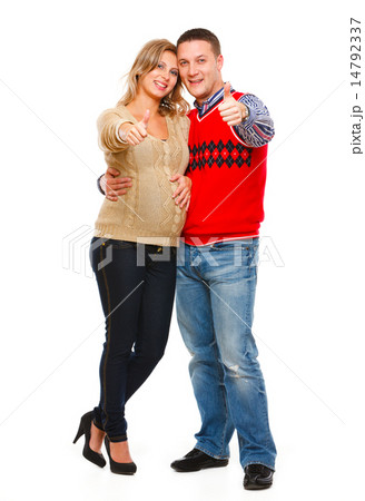 Full length portrait of beautiful pregnant woman with husband sh 14792337