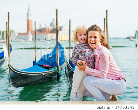 Portrait of happy mother and baby on grand canal embankment in v 14793345