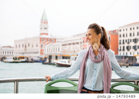 Smiling young woman travel by vaporetto in venice, italy Smiling young woman travel by vaporetto in venice, italy 14793489