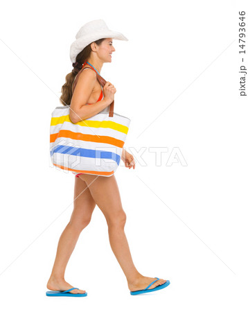 Beach young woman going sideways 14793646
