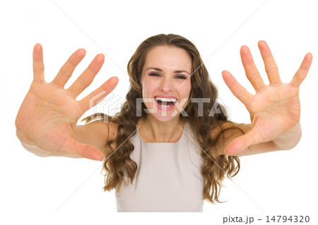 Pretty young woman pulling hands in camera Pretty young woman pulling hands in camera 14794320
