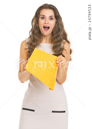 Surprised young woman with letter 14794533