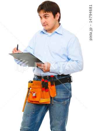 Construction worker checking something and writing in clipboard Construction worker checking something and writing in clipboard 14794681