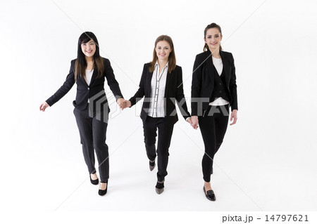 Team of three business women holding hands. 14797621