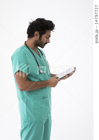 Male Indian doctor wearing a Green Scrubs. Male Indian doctor wearing a Green Scrubs. 14797727
