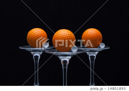 Three glasses of champagne and golf balls 14801893