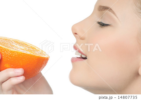 Pretty young woman with half orange Pretty young woman with half orange 14807735